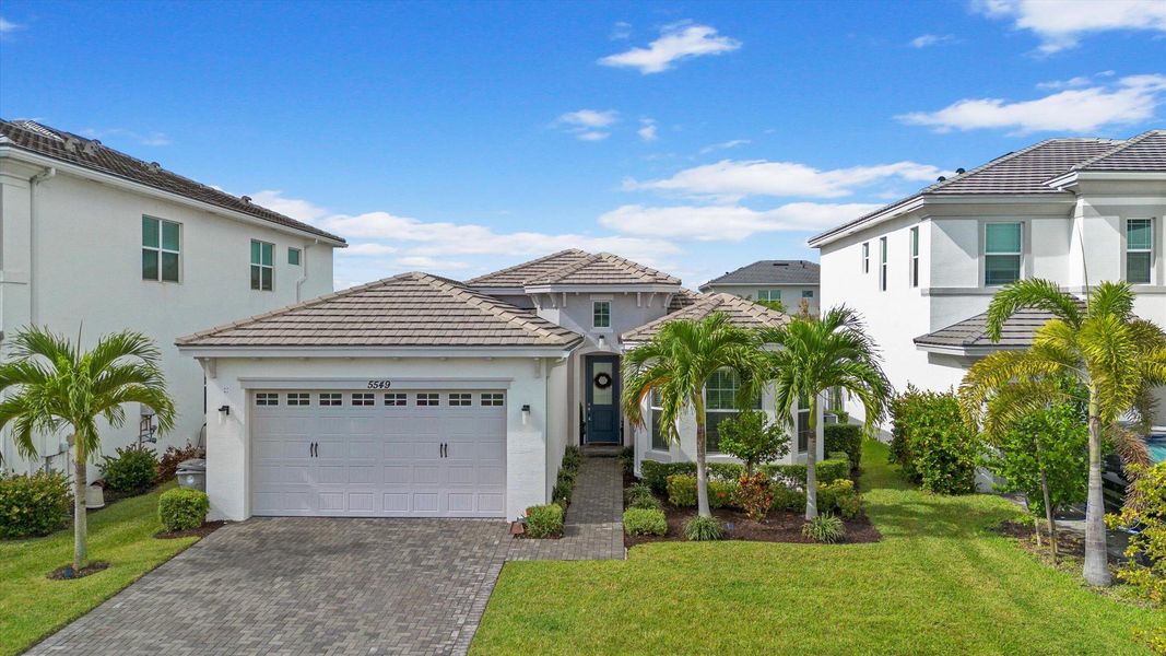 Front exterior of a new home in , Westlake, FL, highlighting curb appeal (Image 2).