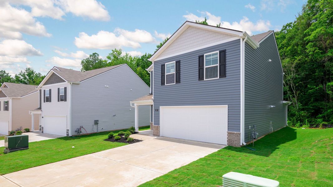 Front exterior of a new home in Hawk's Ridge, Rossville, GA, highlighting curb appeal (Image 17). Front exterior of a new home in Hawk's Ridge, Rossville, GA, highlighting curb appeal (Image 17).