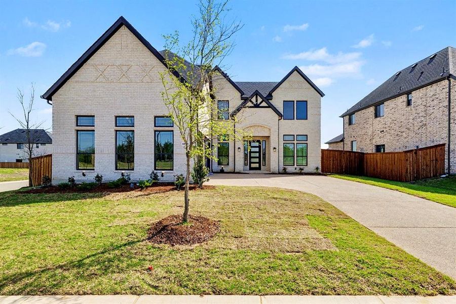 Front exterior of a new home in , Prosper, TX, highlighting curb appeal (Image 19). Front exterior of a new home in , Prosper, TX, highlighting curb appeal (Image 19).
