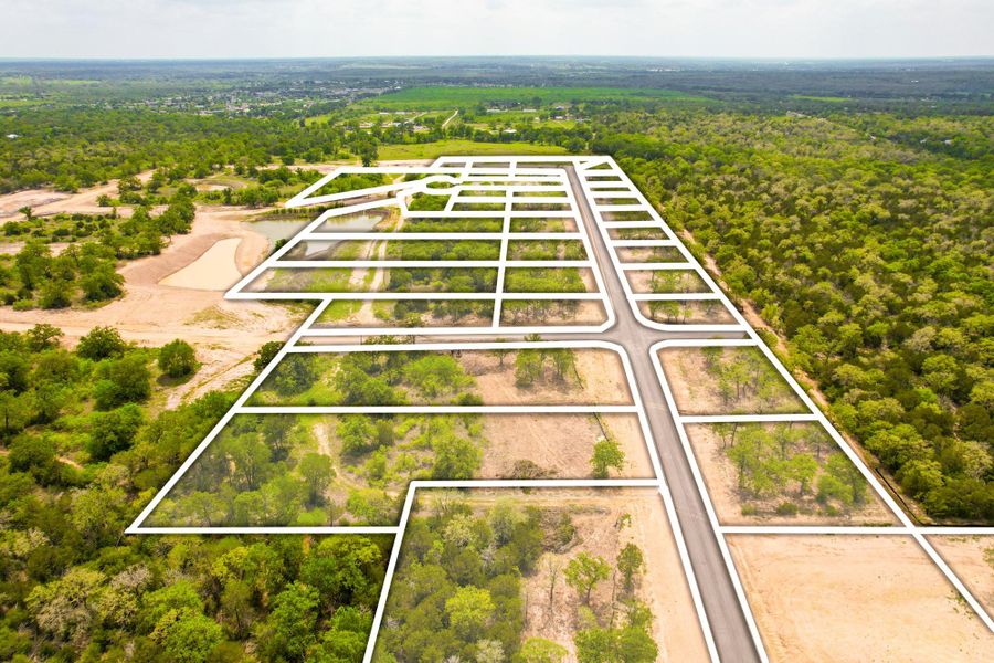 A new community with ample lot sizes surrounded by verdant trees, offering future homeowners peaceful, private settings.