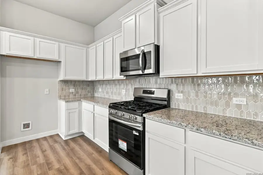 Furnished interior view inside a new home in Hunters Ranch, San Antonio (Image 6).