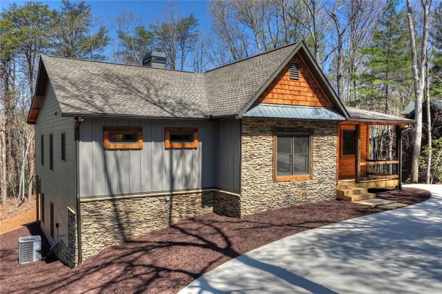 Front exterior of a new home in , Ellijay, GA, highlighting curb appeal (Image 23).