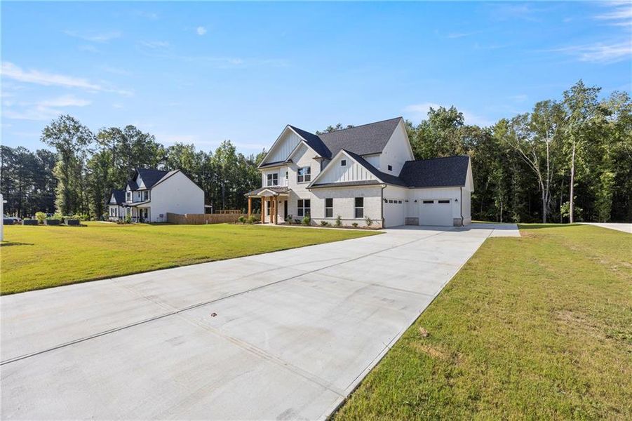 Front exterior of a new home in , Winder, GA, highlighting curb appeal (Image 24).