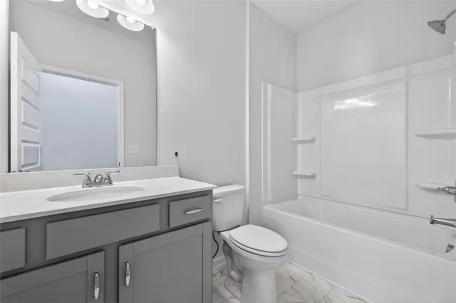 Furnished interior view inside a new home in Summerfield Place, Carrollton (Image 9).