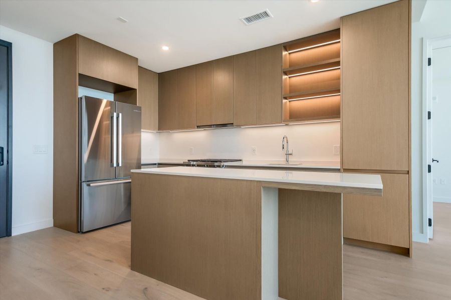 Photos shown are of the same floor plan three floors higher.