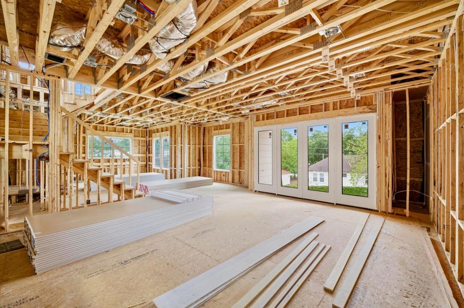 Living area with ample natural light with view of 14 ft x 6 ft covered balcony.