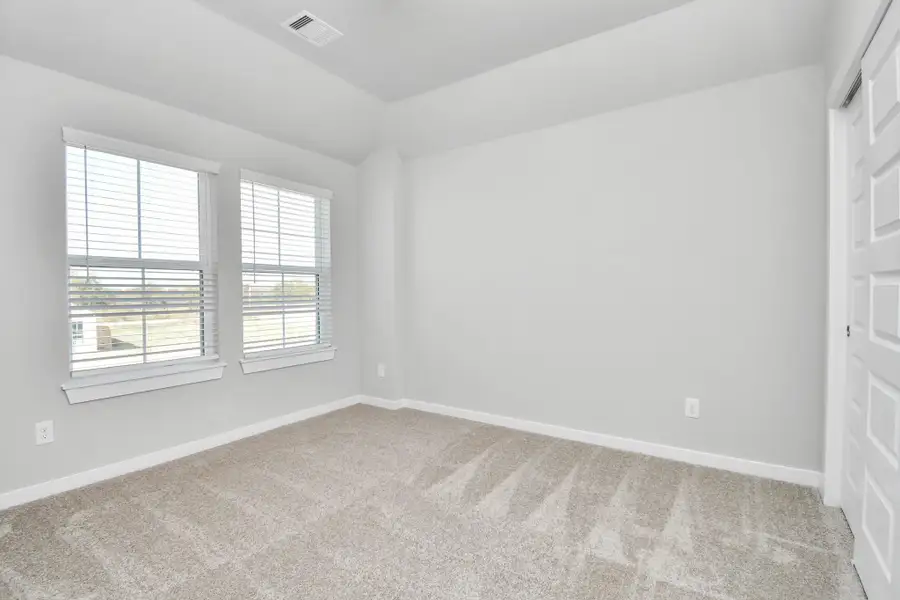 Discover another perspective of the spacious secondary bedrooms! Sample photo of completed home with similar floor plan. Actual colors and selections may vary.
