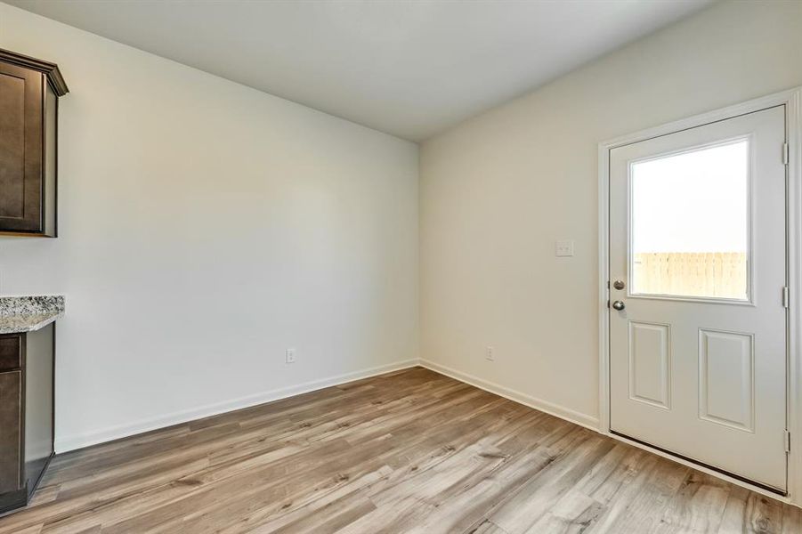 Dining room with light wood-style floors