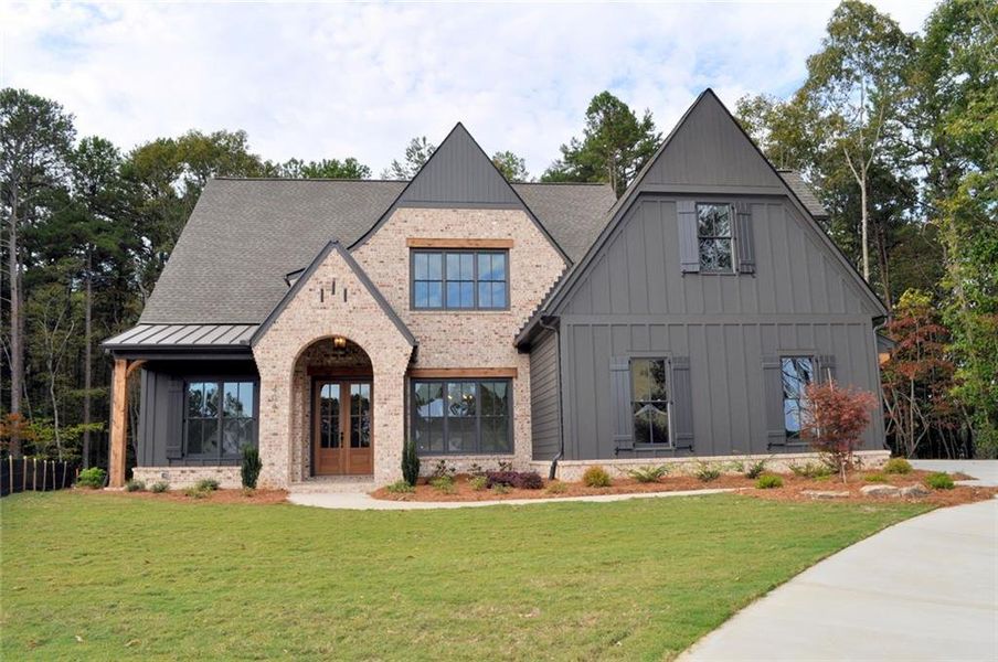 Front exterior of a new home in Woodford, Acworth, GA, highlighting curb appeal (Image 1).