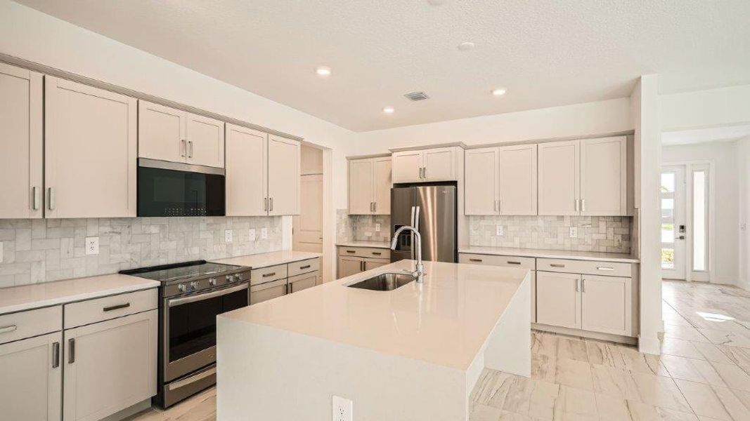 Representative furnished interior of a home built from the Ponte Vedra by D.R. Horton in Preserves at Park Trace, Stuart (Image 6).