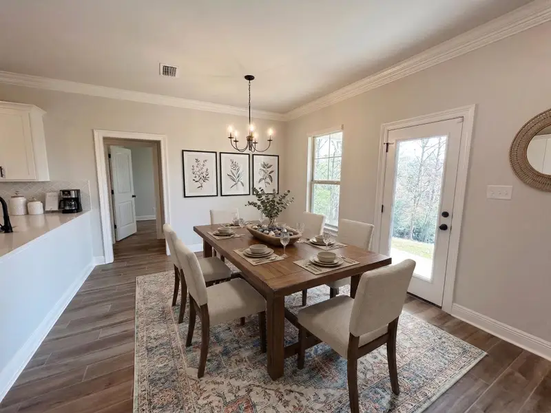 Front exterior of a new home in The Bluffs at Lafayette, Freeport, FL, highlighting curb appeal (Image 14).