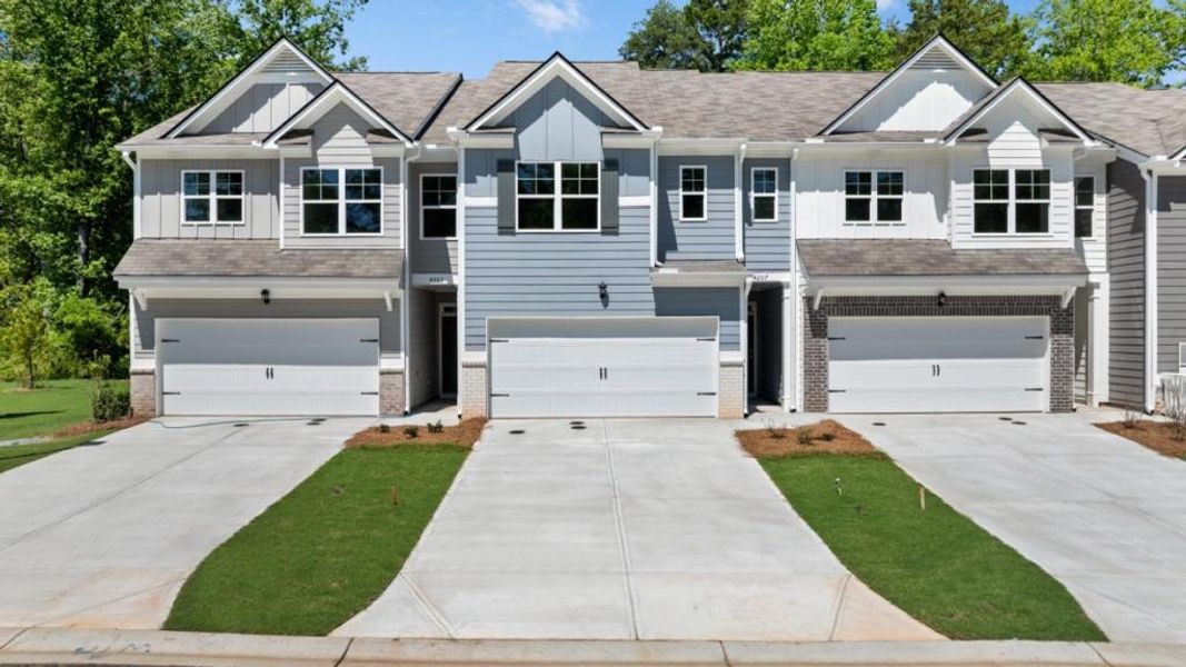Front exterior of a new home in Falcon Landing Townhomes, Gainesville, GA, highlighting curb appeal (Image 1). Front exterior of a new home in Falcon Landing Townhomes, Gainesville, GA, highlighting curb appeal (Image 1).