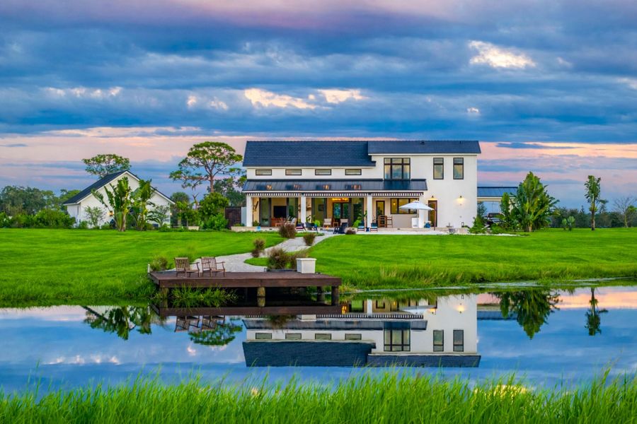 Tranquil sunset over white manor