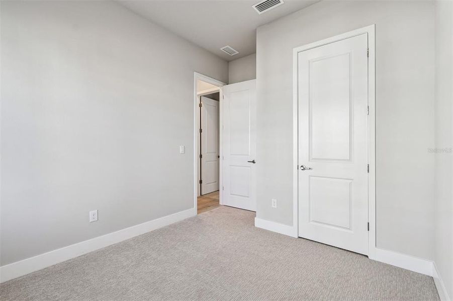 Spacious, unfurnished interior of a new home in Emerald Landing at Waterside at Lakewood Ranch – Cottage Series, Sarasota (Image 32). Spacious, unfurnished interior of a new home in Emerald Landing at Waterside at Lakewood Ranch – Cottage Series, Sarasota (Image 32).