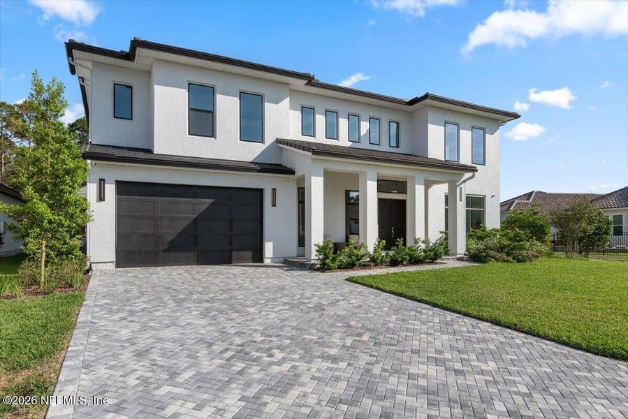 Front exterior of a new home in Tamaya, Jacksonville, FL, highlighting curb appeal (Image 30).
