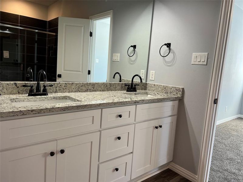 Bathroom with vanity and an enclosed shower