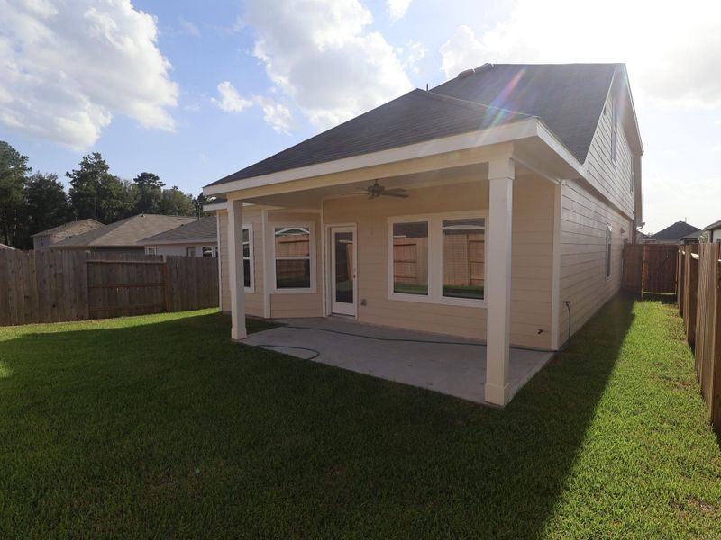 Exterior details and patio area of a home in Pinewood at Grand Texas, New Caney (Image 3).