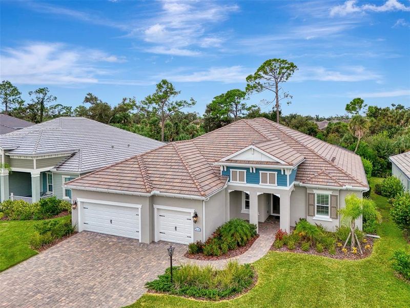 Front exterior of a new home in , Venice, FL, highlighting curb appeal (Image 29).