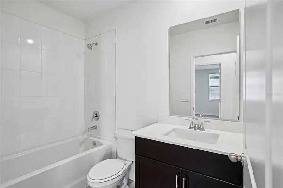 Furnished interior view inside a new home in Ridgehaven - Villas, Ormond Beach (Image 9).