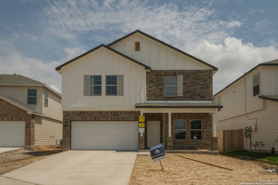 Front exterior of a new home in Blue Ridge Ranch, San Antonio, TX, highlighting curb appeal (Image 16). Front exterior of a new home in Blue Ridge Ranch, San Antonio, TX, highlighting curb appeal (Image 16).
