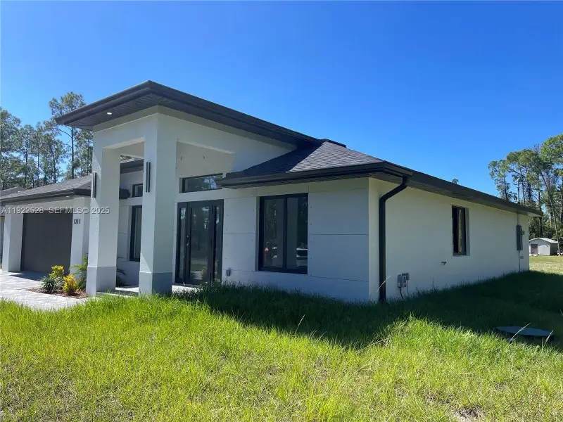 Exterior details and patio area of a home in , Lehigh Acres (Image 3). Exterior details and patio area of a home in , Lehigh Acres (Image 3).