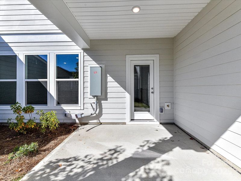 Exterior details and patio area of a home in North Creek Village - Townhomes, Huntersville (Image 21).
