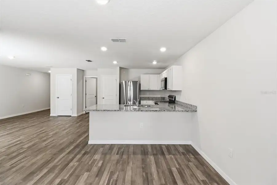 Furnished interior view inside a new home in , Dunnellon (Image 6).