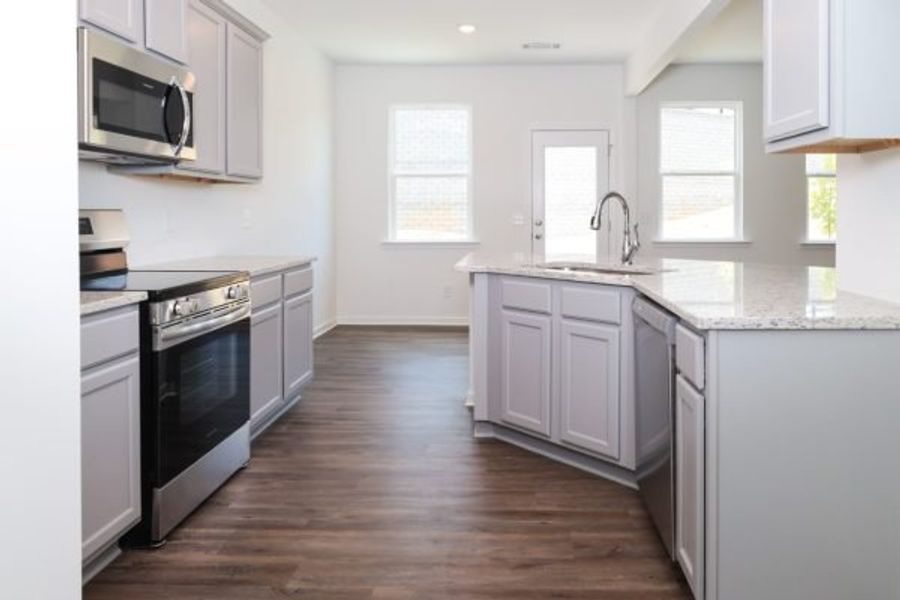 Representative furnished interior of a home built from the Emory Townhome by Piedmont Residential in The Retreat at Browns Ridge, Newnan (Image 13).
