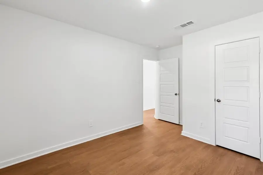 Spacious, unfurnished interior of a new home in Pinewood at Grand Texas, New Caney (Image 12).