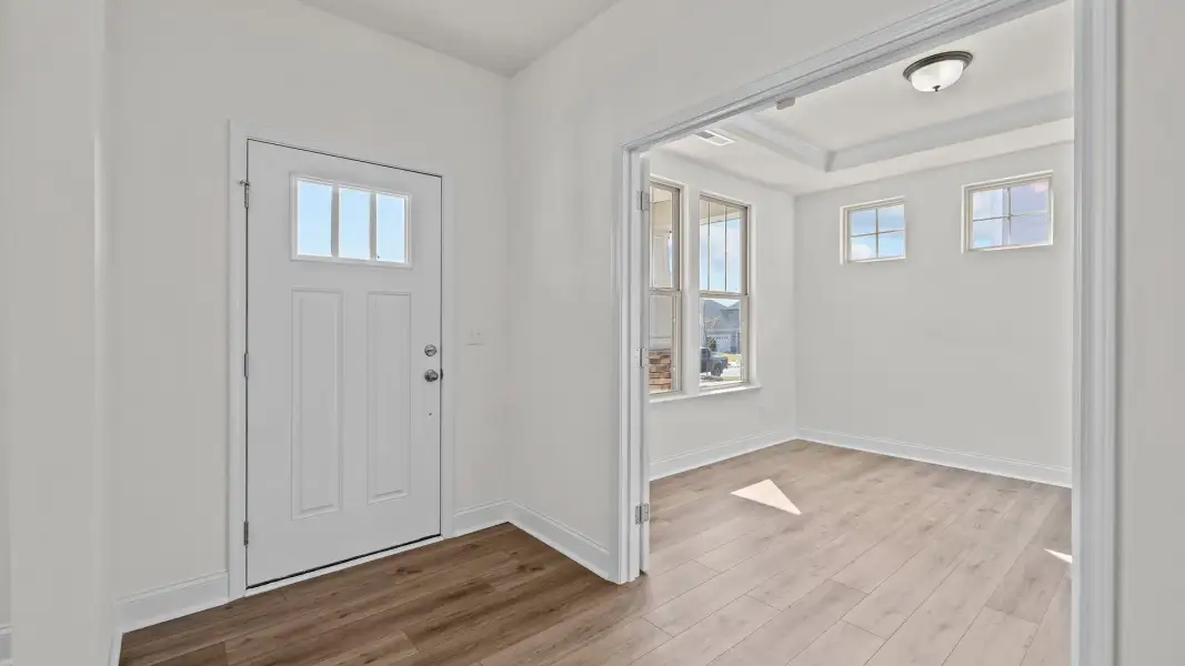 Norris Design inviting wide-entry front door and study with raised tray ceiling. At Lakeside Glen by DRB Homes in York, SC. Norris Design inviting wide-entry front door and study with raised tray ceiling. At Lakeside Glen by DRB Homes in York, SC.