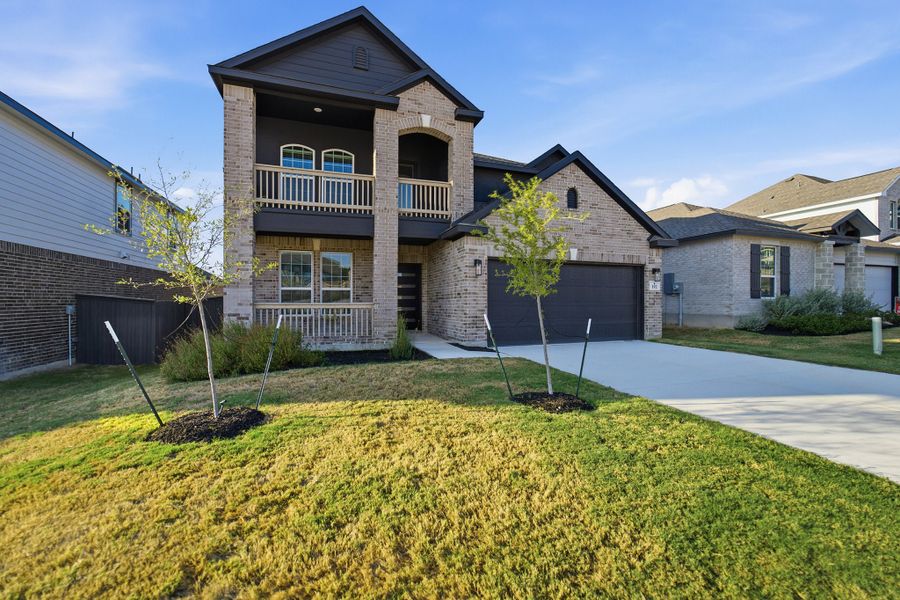 Front exterior of a new home in The Woodlands at Medina Hills, Mico, TX, highlighting curb appeal (Image 2). Front exterior of a new home in The Woodlands at Medina Hills, Mico, TX, highlighting curb appeal (Image 2).