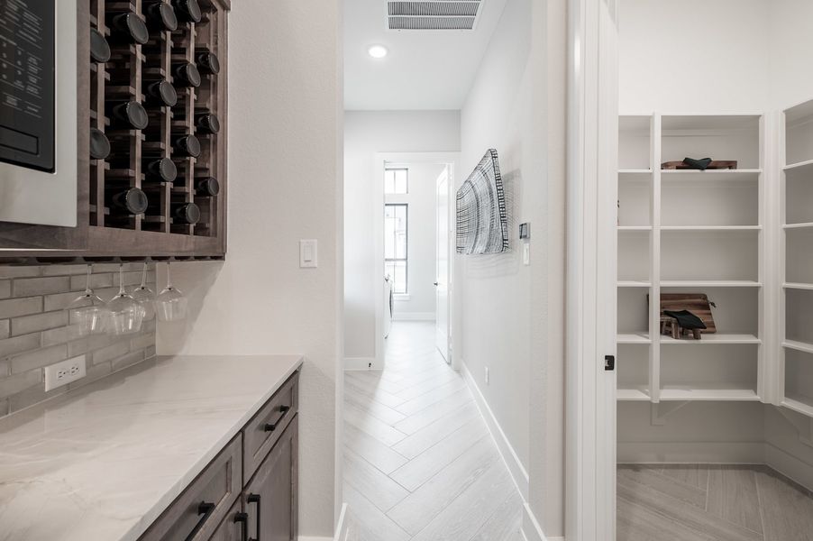 Representative furnished interior of a home built from the Carignan by Tri Pointe Homes in Woodson’s Reserve, Spring (Image 53).