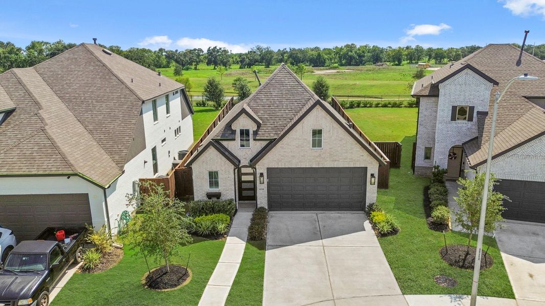 Front exterior of a new home in , Rosharon, TX, highlighting curb appeal (Image 20).