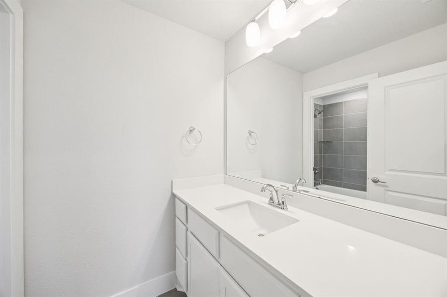 Full bath with vanity and shower / bath combination