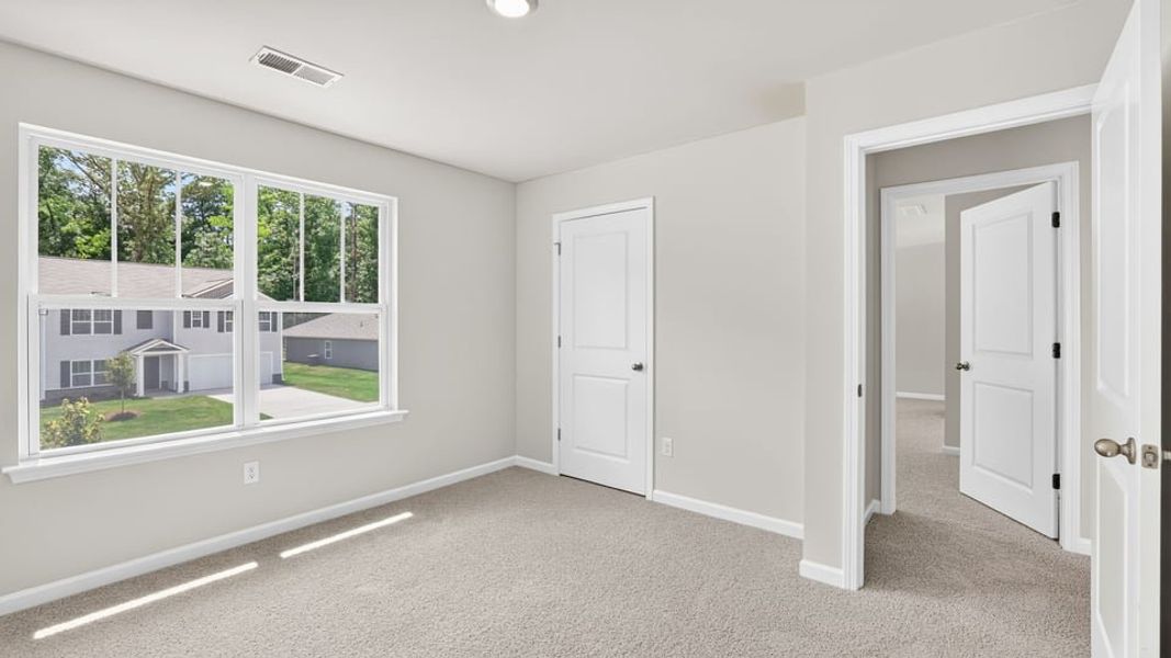 Spacious, unfurnished interior of a new home in Bentley Park, Greenwood (Image 29).