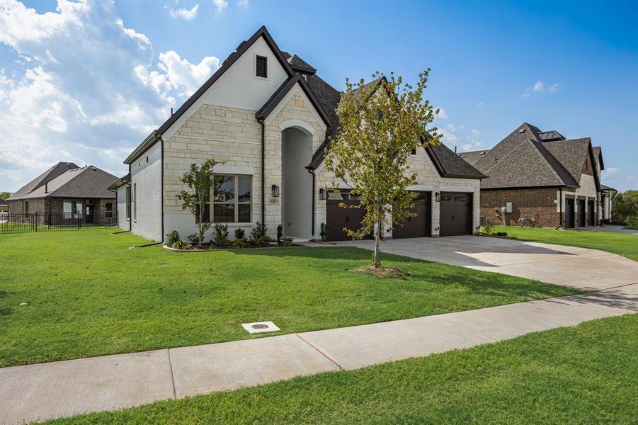 Front exterior of a new home in Heath Golf and Yacht, Heath, TX, highlighting curb appeal (Image 26).