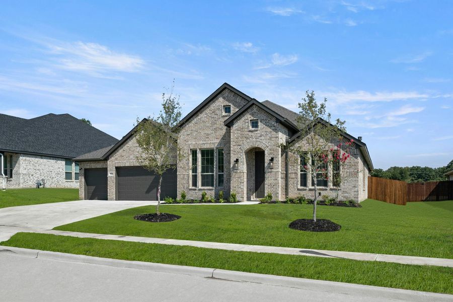 Front exterior of a new home in Stone Eagle, Azle, TX, highlighting curb appeal (Image 2).