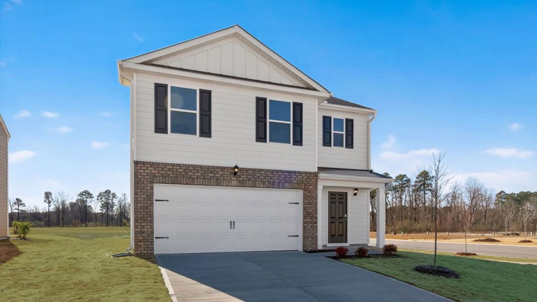 Front exterior of a new home in Carter Ridge, Greenville, NC, highlighting curb appeal (Image 2). Front exterior of a new home in Carter Ridge, Greenville, NC, highlighting curb appeal (Image 2).