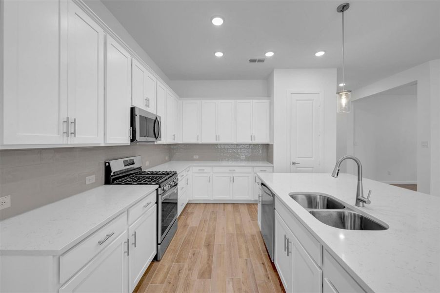 Furnished interior view inside a new home in Meridiana - Terrace Collection, Manvel (Image 7).