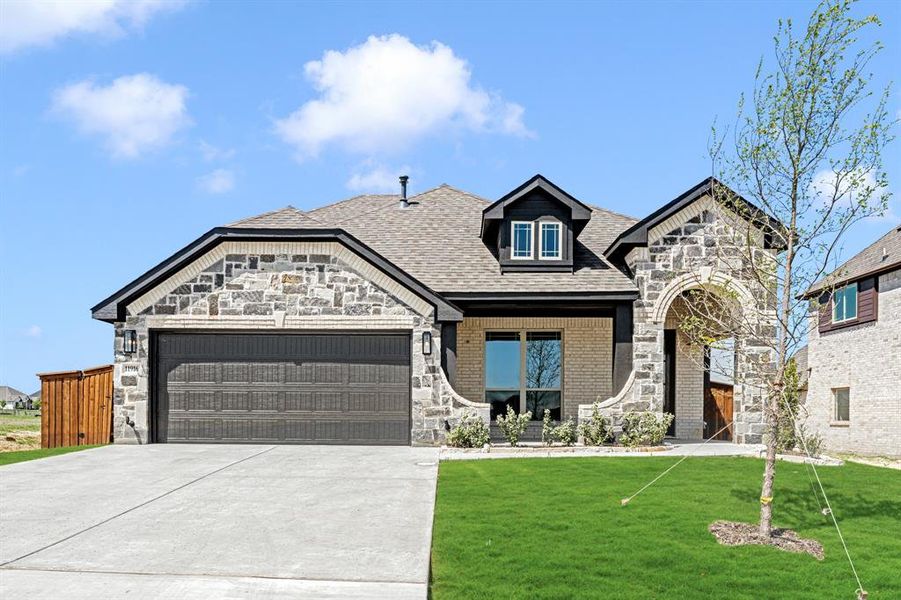 Front exterior of a new home in Wildcat Ridge Phase 3, Godley, TX, highlighting curb appeal (Image 1). Front exterior of a new home in Wildcat Ridge Phase 3, Godley, TX, highlighting curb appeal (Image 1).