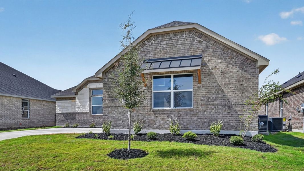 Representative exterior photo of a completed home built from the Bartlett by D.R. Horton in Lakeview Pointe, Midlothian, TX (Image 18).