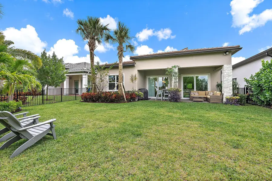 Exterior details and patio area of a home in Avondale at Avenir, Palm Beach Gardens (Image 3).