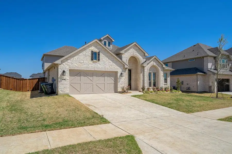 Front exterior of a new home in , Prosper, TX, highlighting curb appeal (Image 2). Front exterior of a new home in , Prosper, TX, highlighting curb appeal (Image 2).