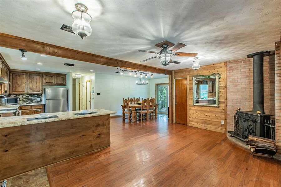 Open-concept living, dining, and kitchen areas create the perfect space for gathering and entertaining. Open-concept living, dining, and kitchen areas create the perfect space for gathering and entertaining.