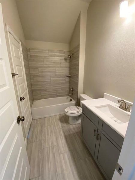 Bath #3 upstairs features 12x24 ceramic tile floors & walls in shower/bath, and Monet quartz vanity.