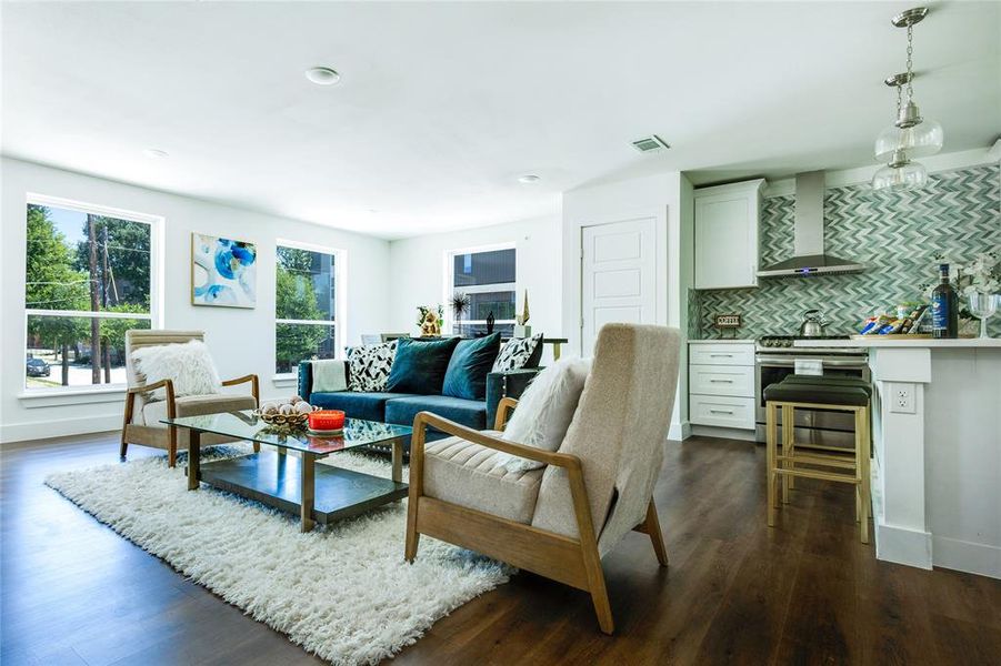 Living room with dark wood-type flooring