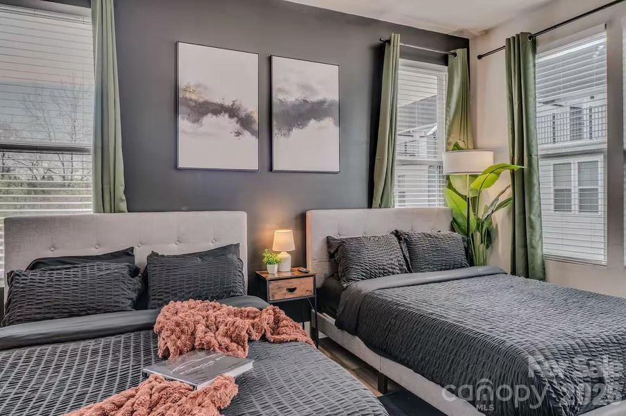 The spacious secondary bedroom offers abundant natural light, generous closet space, and room for multiple beds, making it ideal for guests, family, or a flexible home office setup. The spacious secondary bedroom offers abundant natural light, generous closet space, and room for multiple beds, making it ideal for guests, family, or a flexible home office setup.