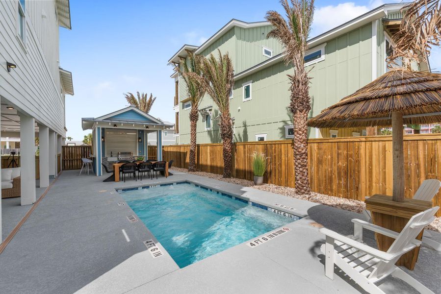 View of pool featuring a gazebo, a fenced backyard, a patio, a pool, and outdoor dining space View of pool featuring a gazebo, a fenced backyard, a patio, a pool, and outdoor dining space