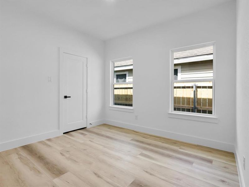 Unfurnished room with light hardwood / wood-style flooring