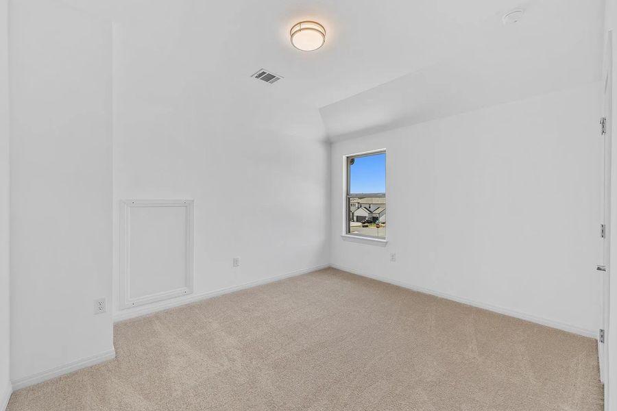 Unfurnished room with light colored carpet